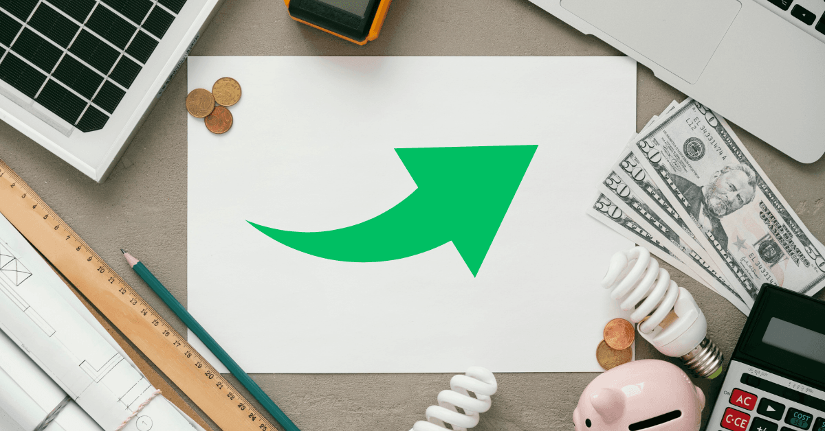 Green arrow on paper surrounded by coins, cash, light bulbs, a calculator, and architectural plans, symbolizing strategies for boosting ROI in Boston property management.