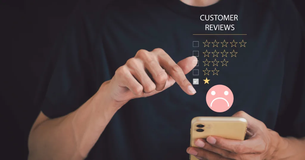 A person is holding a phone with a "Customer Reviews"