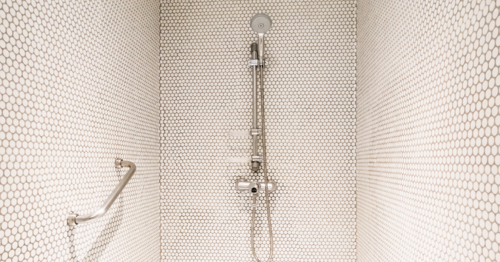 Tackling a Leaking Pipe Behind Tiled Showers