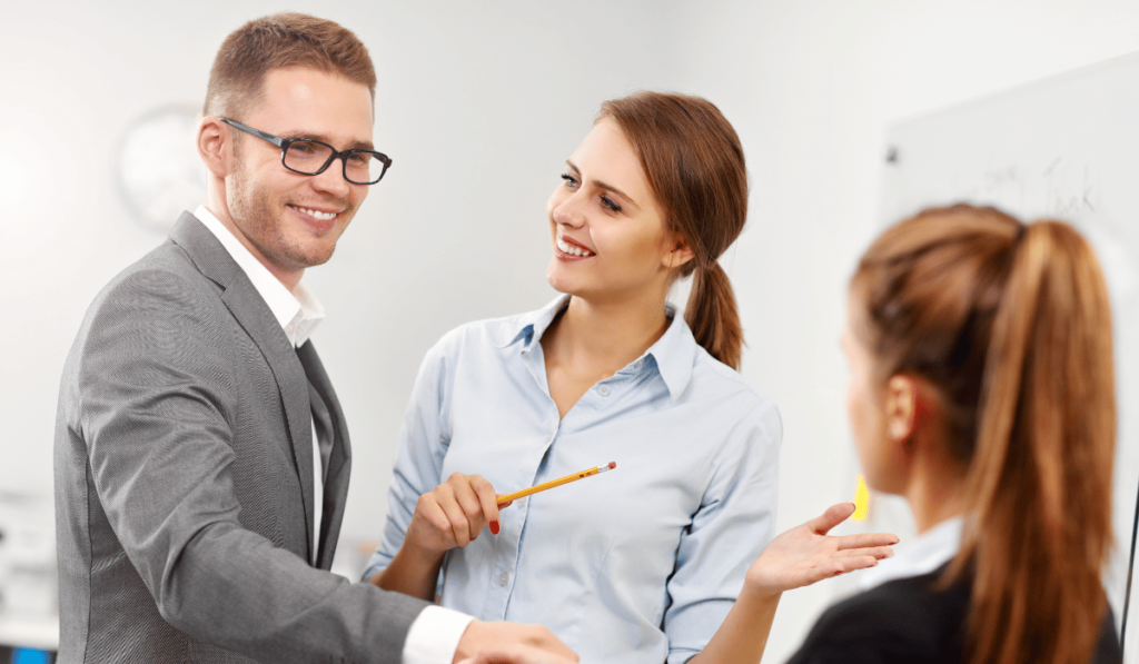 Three business professionals are in a meeting