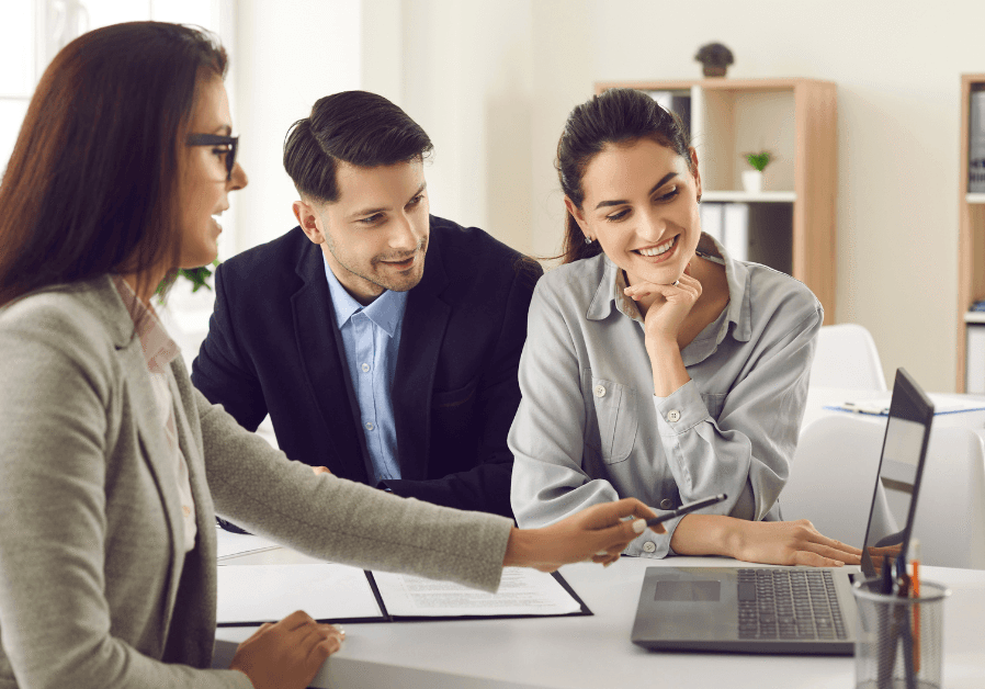 Property manager and condo trustee reviewing a management agreement together